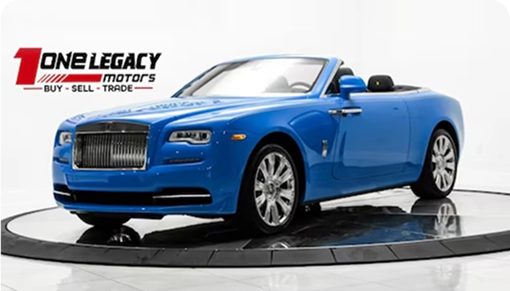 Blue 2021 Rolls-Royce Dawn convertible with the roof down, photographed on the One Legacy Motors turntable
