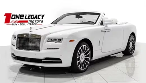 White 2018 Rolls-Royce Dawn convertible with the roof down, photographed on the One Legacy Motors showroom floor