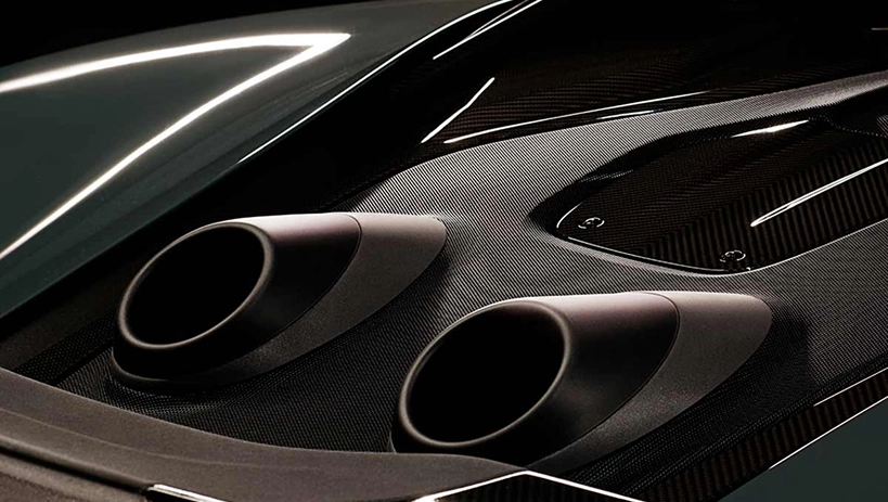 Close-up of the McLaren 600LT's twin top-exit exhaust tips set into its carbon fibre rear deck
