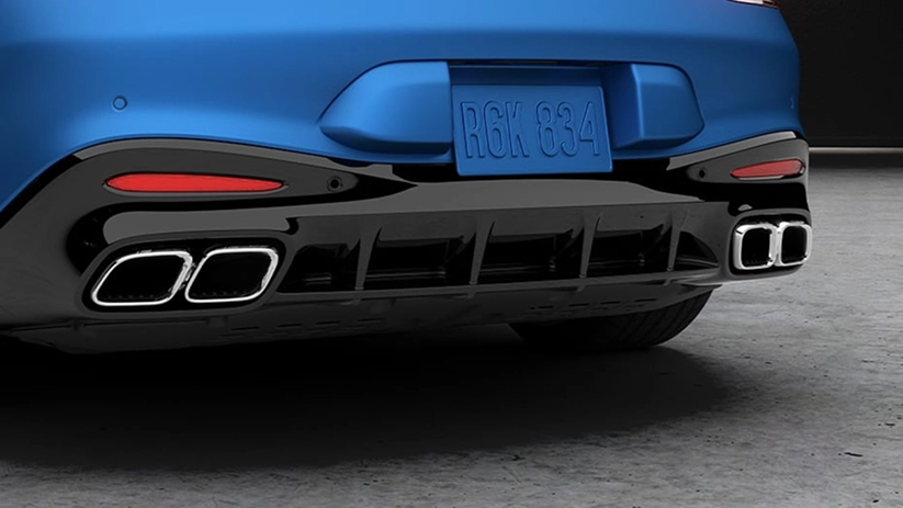 Close-up of a blue Mercedes-AMG's rear diffuser and quad exhaust tips