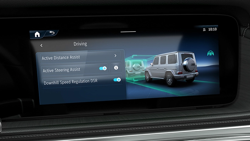 Mercedes-Benz centre display showing the Driving menu with Active Distance Assist and Active Steering Assist
