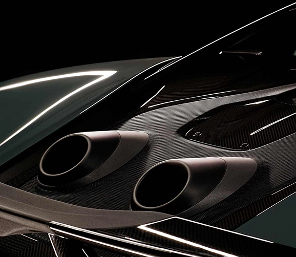 Close-up of the McLaren 600LT's twin top-exit exhaust tips and carbon fibre engine cover