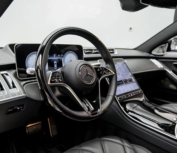 Black Mercedes-Maybach S-Class on a turntable in the One Legacy Motors showroom