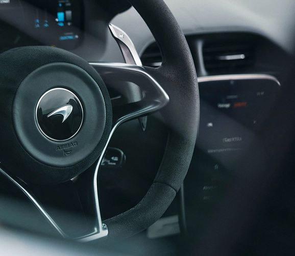 McLaren Artura steering wheel with the marque's logo, an Alcantara rim and paddle shifters