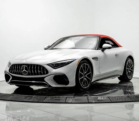 White Mercedes-AMG SL roadster with a red soft top on the One Legacy Motors turntable