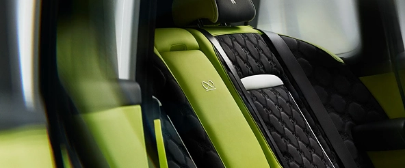 Rolls-Royce Cullinan interior with lime green leather seats and black quilted trim