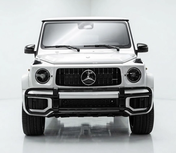Head-on view of a white Mercedes-AMG G 63 in a white studio
