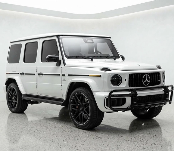 White Mercedes-AMG G 63 seen from the front three-quarter in a white studio