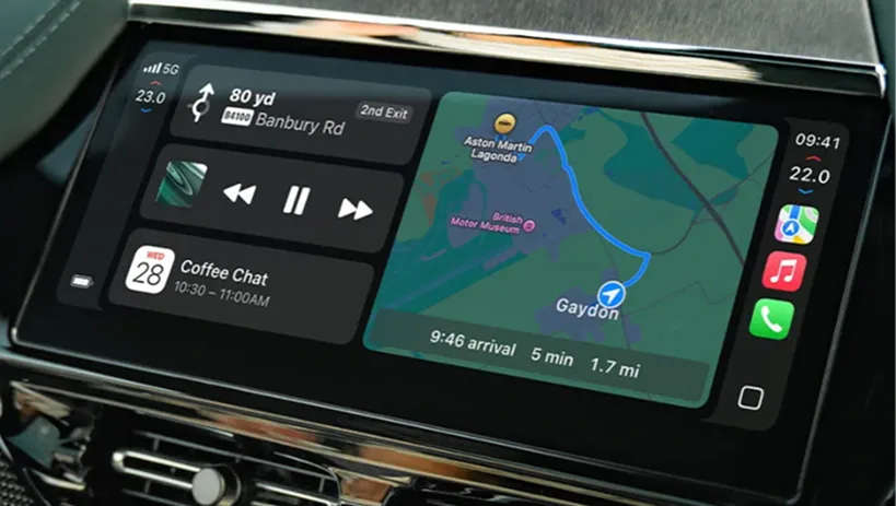 Aston Martin touchscreen showing Apple CarPlay navigation and media
