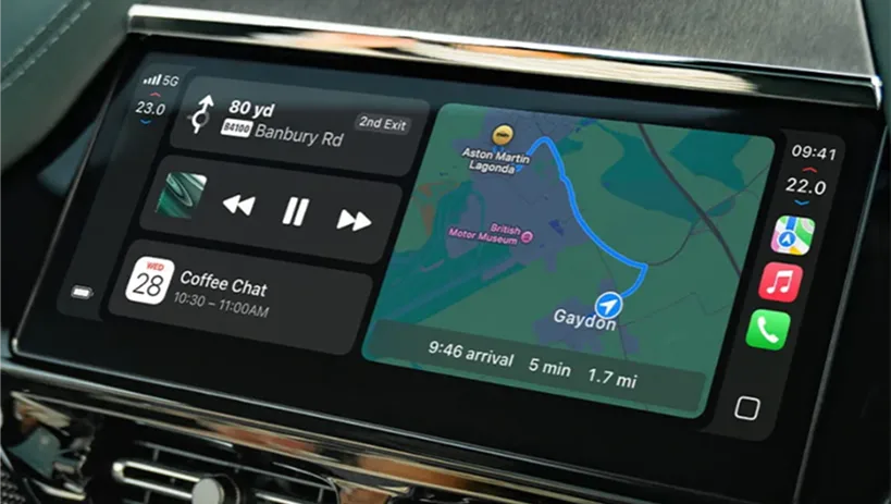 Aston Martin touchscreen showing Apple CarPlay navigation and media