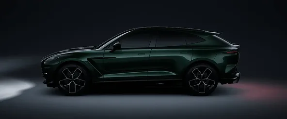 Green Aston Martin DBX 707 in profile against a dark studio background