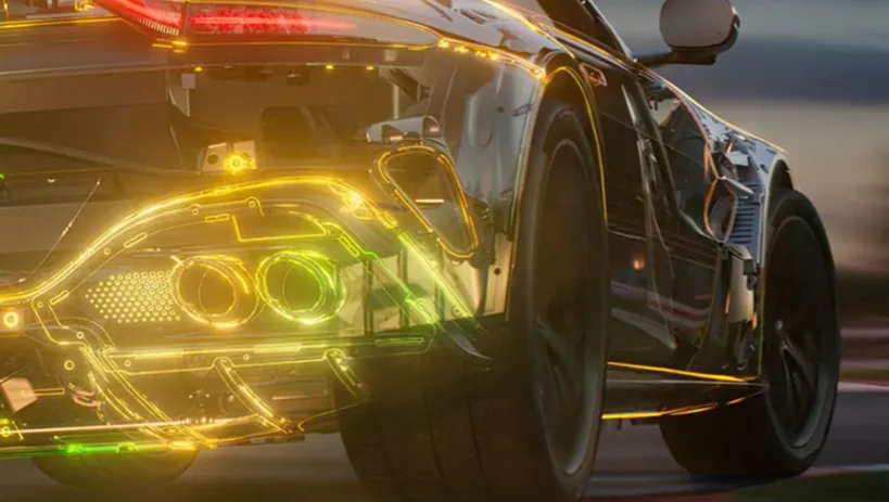 Yellow Aston Martin Vantage on track with its exhaust airflow visualised in colour
