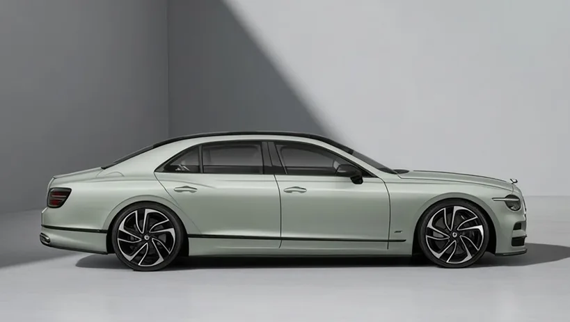 Pale green Bentley Flying Spur in profile in a studio