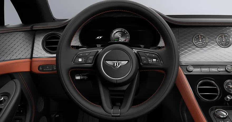Bentley Continental GT steering wheel with orange trim and knurled dials
