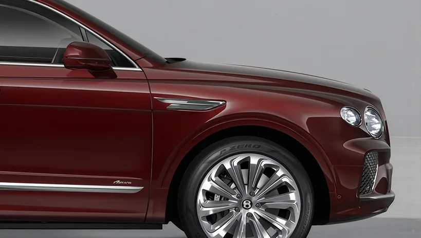 Front three-quarter view of a dark red Bentley Bentayga EWB