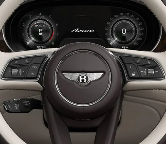 Bentley steering wheel and dashboard finished in cream and dark leather