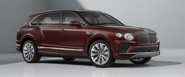 Dark red Bentley Bentayga EWB photographed in a pale studio