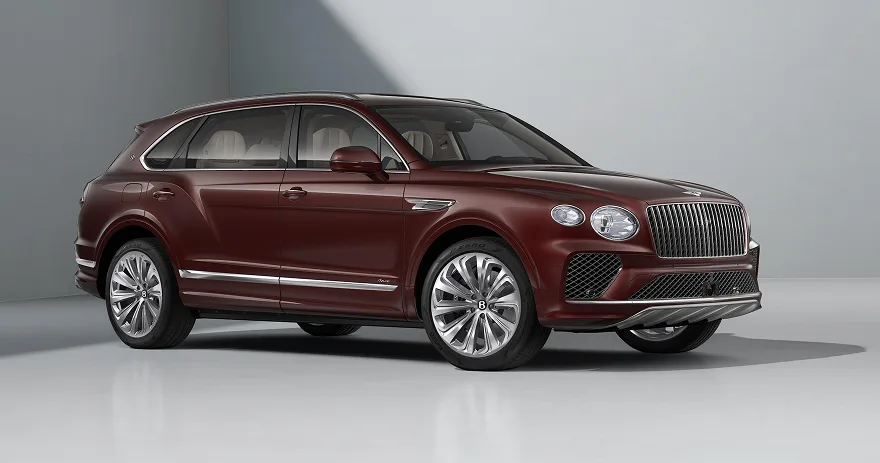Dark red Bentley Bentayga EWB photographed in a pale studio