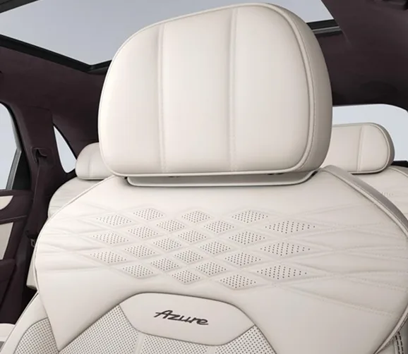 Close-up of a cream diamond-quilted Bentley seat with embroidered Azure badging