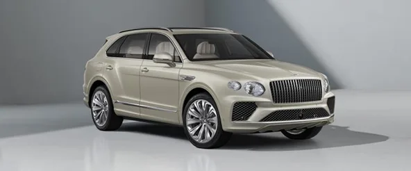 Front three-quarter view of a cream Bentley Bentayga