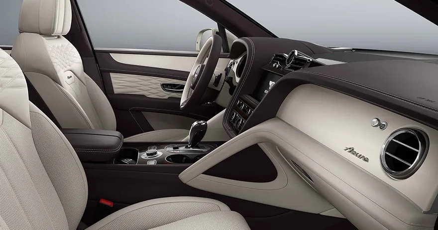 Bentley Bentayga cabin with cream leather and dark brown dashboard trim