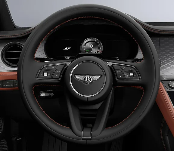 Bentley Continental GT cockpit with orange trim and knurled controls
