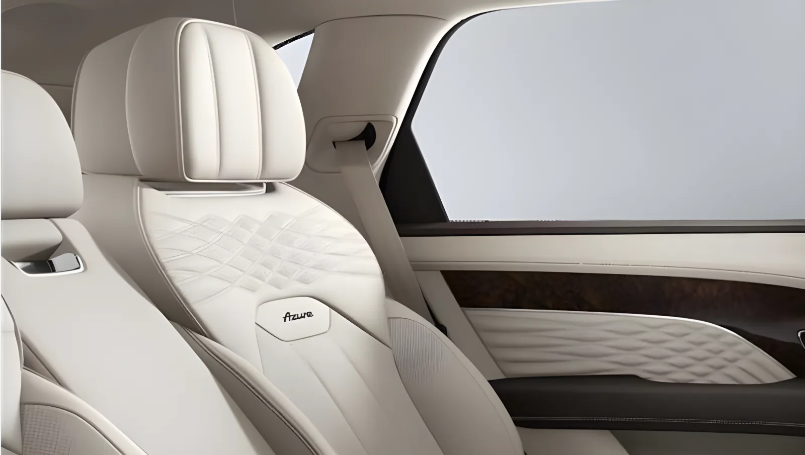 Rear seats of a Bentley Bentayga EWB in cream quilted leather beneath a panoramic roof