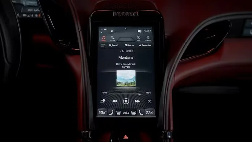 Ferrari Roma central infotainment touchscreen displaying the media player in portrait orientation