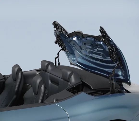 Ferrari Roma Spider with its fabric roof folding away into the rear deck