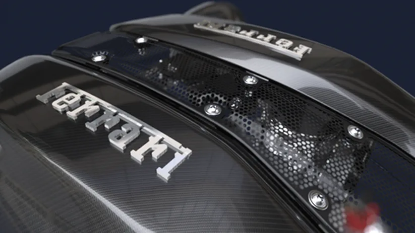 Carbon fibre engine cover with a raised chrome Ferrari script over the 488 Pista's V8