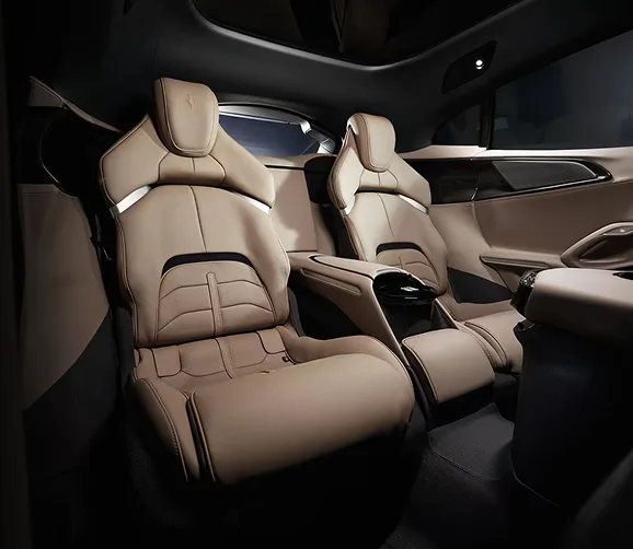 Tan leather rear cabin of a Ferrari Purosangue with two individual bucket seats