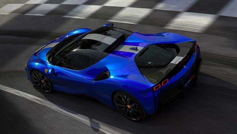 Blue Ferrari SF90 Spider Assetto Fiorano with a black centre stripe, seen from above crossing the start-finish line on a race track