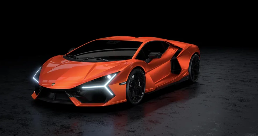 Orange Lamborghini Revuelto lit against a black studio background