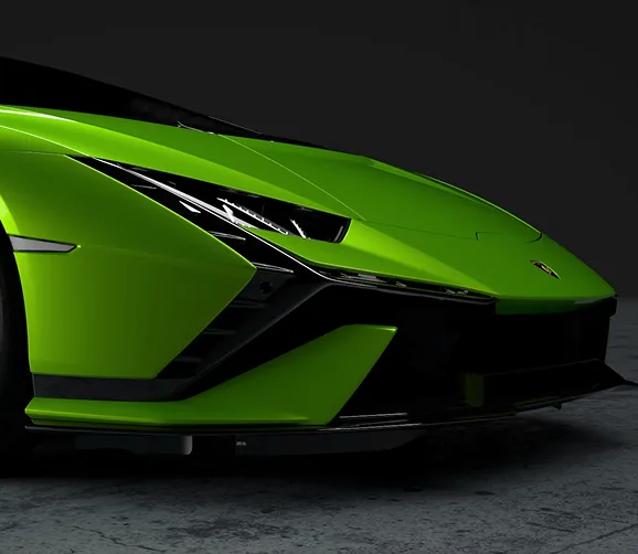 Front detail of a green Lamborghini Huracan showing its headlight and side vent