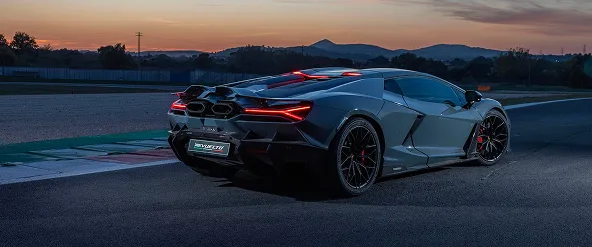 Grey Lamborghini Revuelto parked on a circuit at dusk