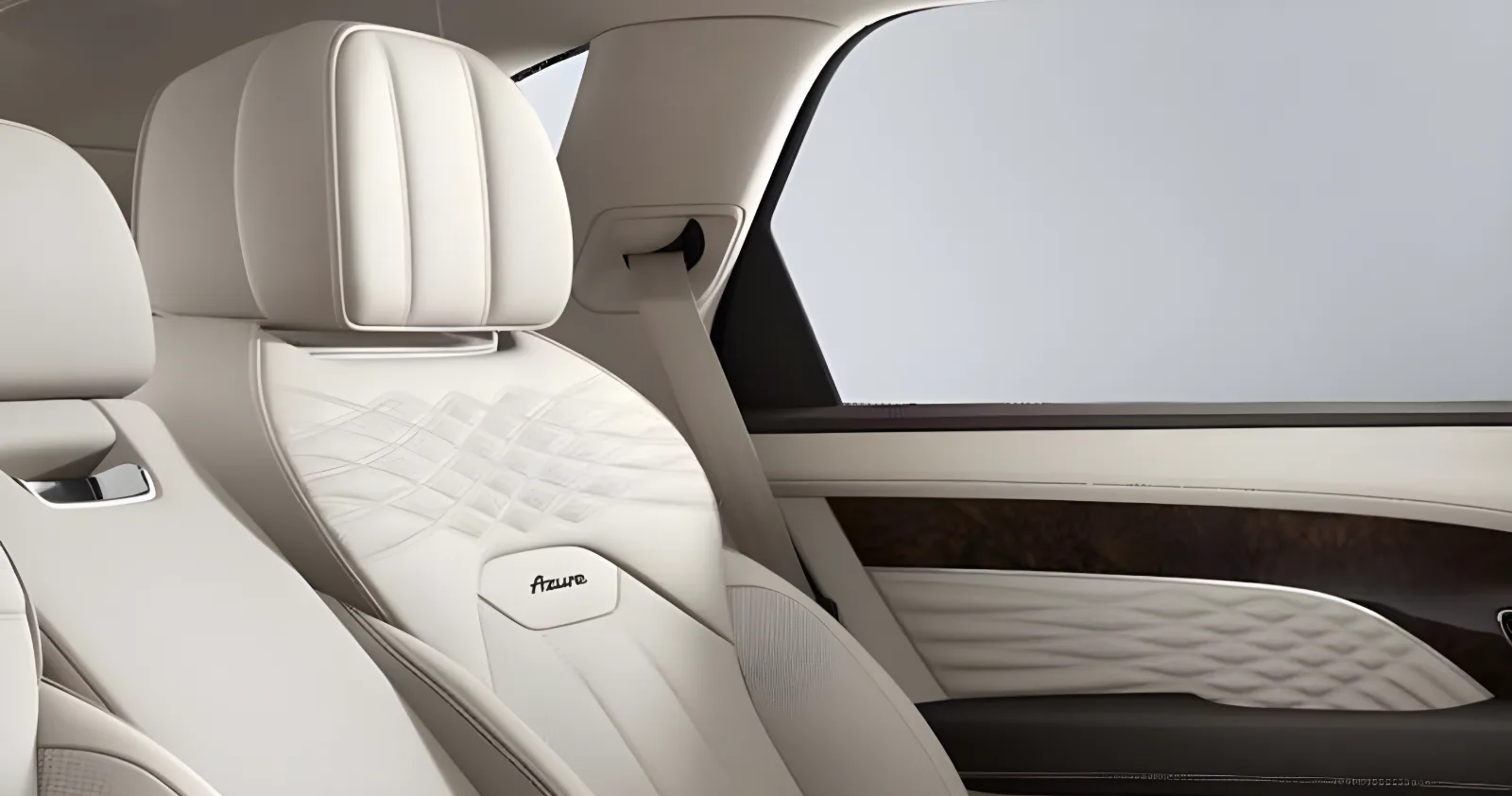 Rear seats of a Bentley Bentayga EWB in cream quilted leather beneath a panoramic roof