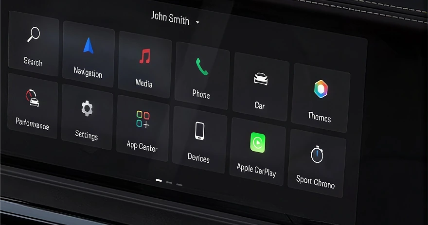 Porsche touchscreen home screen with tiles for navigation, media, phone, App Center and Sport Chrono