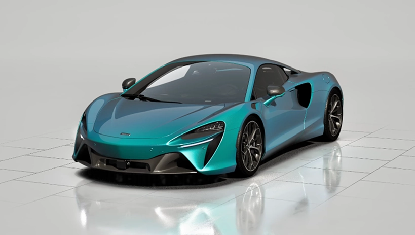 Teal McLaren Artura at a front three-quarter angle on a white studio floor